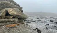 A 1300-year-old arrow as it was found lying on the ice at the Lendbreen ice patch in Innlandet County, Norway