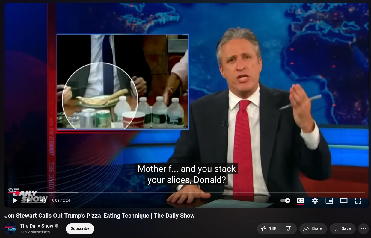 screenshot of youtube video of a 2008 episode of the daily show, showing donald trump eating a stack of two slices of NY pizza using a knife and fork. jon stewart looks dismayed, and there is a subtitle saying "Mother f... and you stack your slices, Donald?"