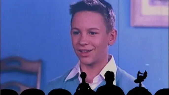 Screenshot from MST3k short "Mr B Natural" with a kid who has a haircut similar to OP