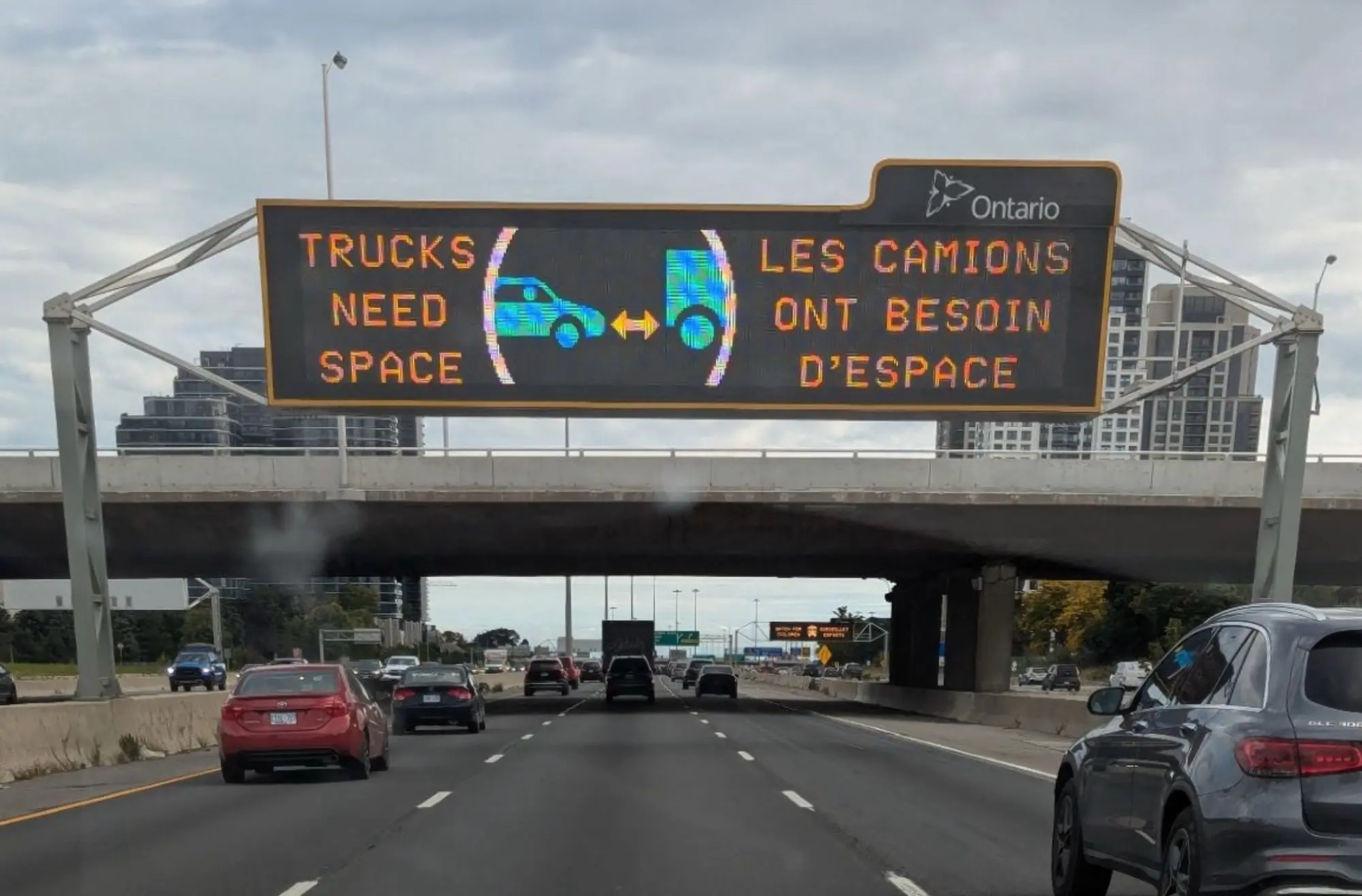 highway sign that says "trucks need space"