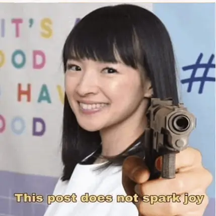 KonMari holding a gun