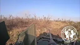 Lucky gunner of a Ukranian Bradley M2A2 turns his turret right before a tank hits the reactive armor.